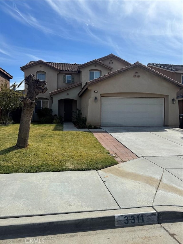 3311 Aster Ln, Perris, CA 92571 - mediterranean / spanish home featuring driveway, a front lawn, stucco siding, an attached garage, and a tiled roof