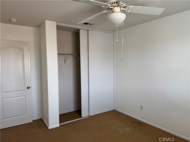 3311 Aster Ln, Perris, CA 92571 - unfurnished bedroom featuring carpet floors, a closet, baseboards, and ceiling fan