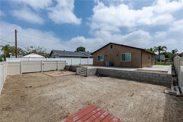 1143 Webster St, Redlands, CA 92374 - view of yard featuring central AC, a fenced backyard, and a patio area