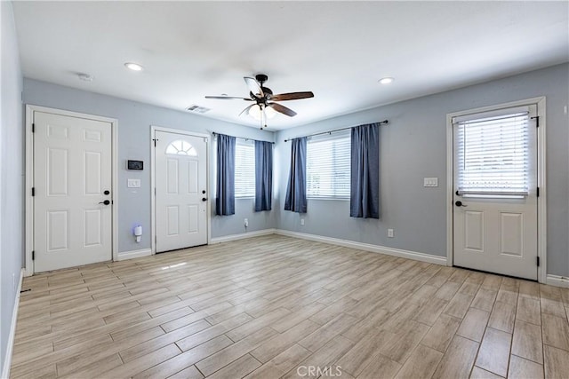 1143 Webster St, Redlands, CA 92374 - foyer entrance with light wood-style floors, baseboards, and ceiling fan
