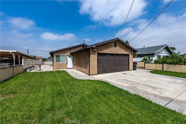1143 Webster St, Redlands, CA 92374 - ranch-style house featuring a front yard, a garage, fence, concrete driveway, and stucco siding