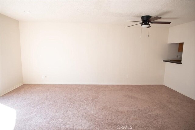 719 N Eucalyptus Ave Unit 19A, Inglewood, CA 90302 - carpeted empty room with baseboards and ceiling fan