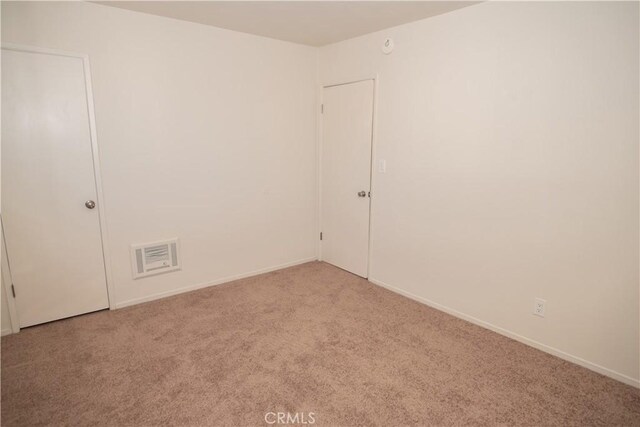 719 N Eucalyptus Ave Unit 19A, Inglewood, CA 90302 - carpeted empty room with visible vents and baseboards
