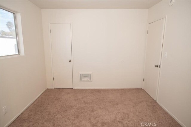 719 N Eucalyptus Ave Unit 19A, Inglewood, CA 90302 - carpeted empty room featuring visible vents and baseboards
