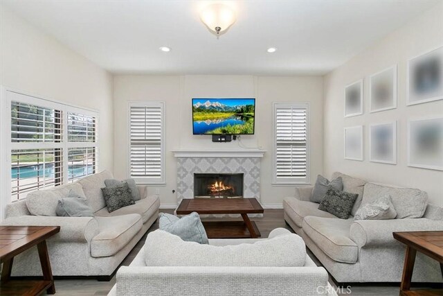 1618 Southport Dr, Riverside, CA 92506 - living room with wood finished floors, a fireplace, and recessed lighting