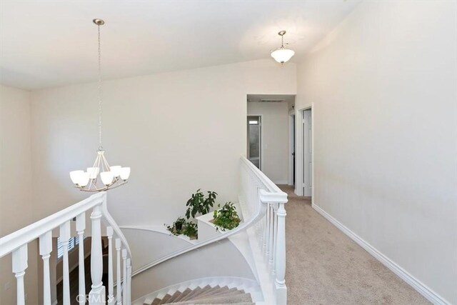 1618 Southport Dr, Riverside, CA 92506 - staircase with a chandelier, carpet flooring, and baseboards