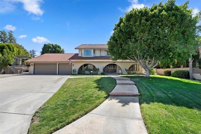 1618 Southport Dr, Riverside, CA 92506 - view of front facade featuring an attached garage, stucco siding, concrete driveway, a front yard, and a tile roof