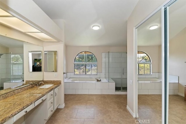 1618 Southport Dr, Riverside, CA 92506 - full bath featuring vanity, a garden tub, and plenty of natural light