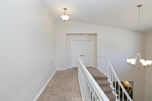 1618 Southport Dr, Riverside, CA 92506 - corridor with light carpet, a chandelier, an upstairs landing, vaulted ceiling, and baseboards