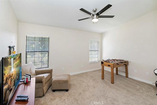 1618 Southport Dr, Riverside, CA 92506 - sitting room featuring ceiling fan, healthy amount of natural light, light carpet, and baseboards