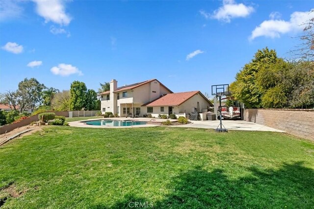 1618 Southport Dr, Riverside, CA 92506 - back of house with a patio area and a chimney