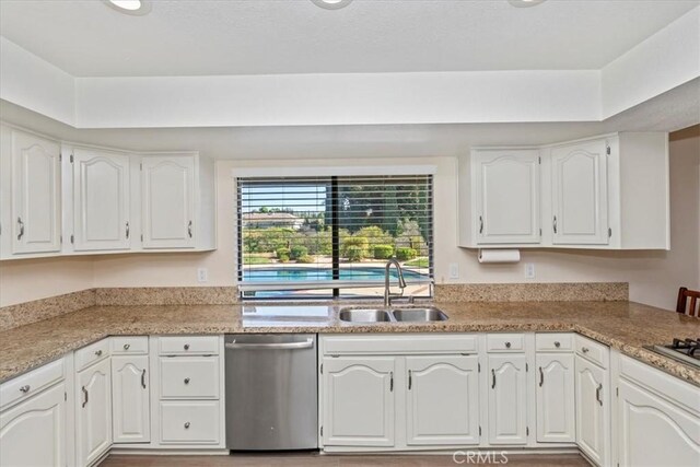 1618 Southport Dr, Riverside, CA 92506 - kitchen with dishwasher, a sink, white cabinets, and light countertops