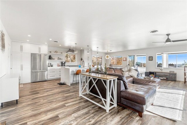 54660 Benecia Trl, Yucca Valley, CA 92284 - living room featuring wood finished floors, recessed lighting, and a ceiling fan