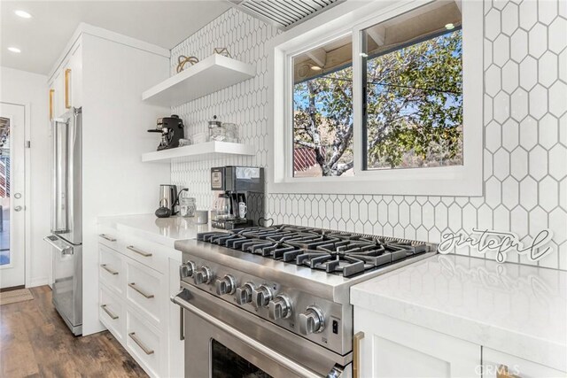 kitchen with open shelves, recessed lighting, backsplash, light countertops, and appliances with stainless steel finishes