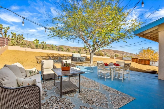 view of patio with a fenced backyard and outdoor lounge area