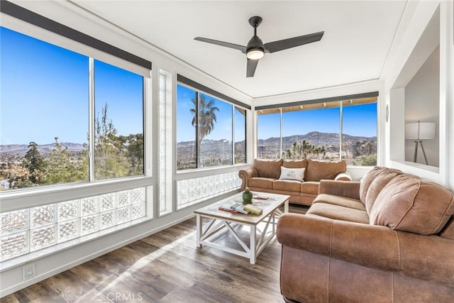 54660 Benecia Trl, Yucca Valley, CA 92284 - sunroom / solarium with a mountain view, wood finished floors, and healthy amount of natural light