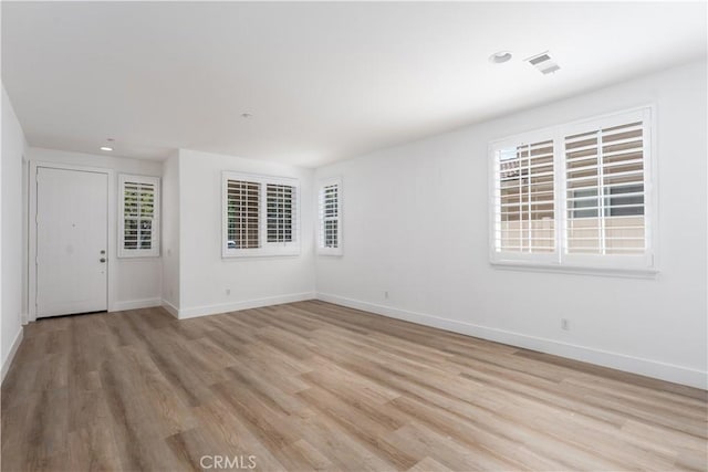 1677 Catania Dr, Riverside, CA 92507 - spare room with plenty of natural light, baseboards, visible vents, and light wood-style floors