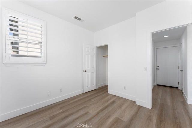 1677 Catania Dr, Riverside, CA 92507 - unfurnished bedroom featuring baseboards, visible vents, and light wood-style floors