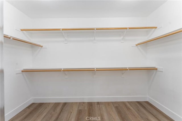 1677 Catania Dr, Riverside, CA 92507 - spacious closet with wood finished floors