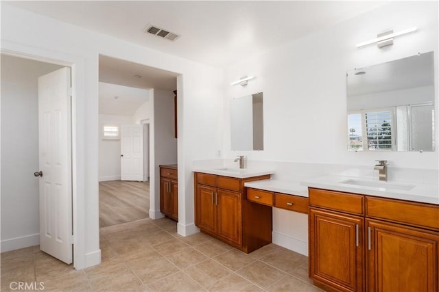 1677 Catania Dr, Riverside, CA 92507 - full bath featuring visible vents, a sink, tile patterned flooring, and double vanity