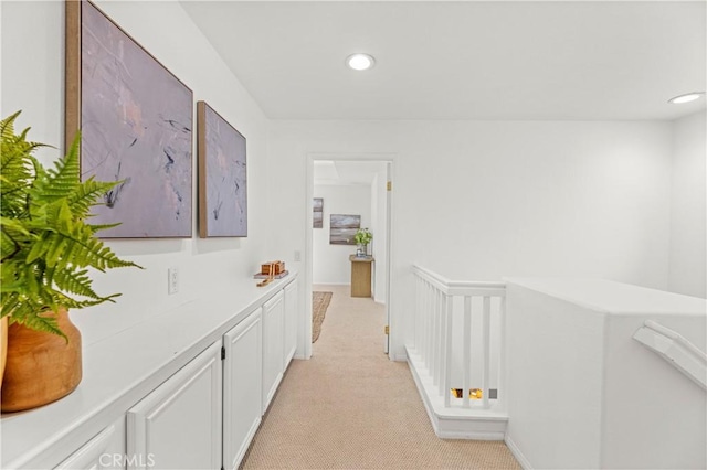 hall with light carpet and recessed lighting