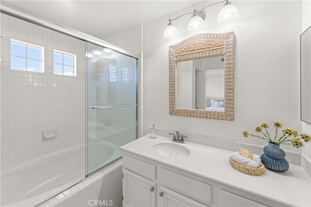 bathroom featuring vanity and tiled shower / bath combo