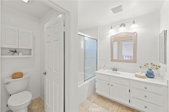 full bathroom with combined bath / shower with glass door, visible vents, toilet, and vanity