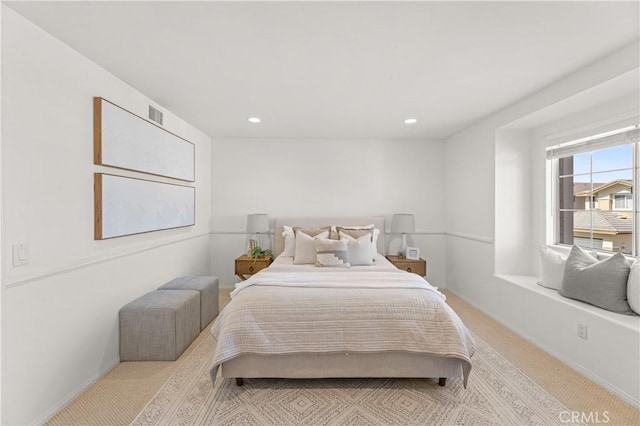 bedroom featuring baseboards, visible vents, carpet, and recessed lighting