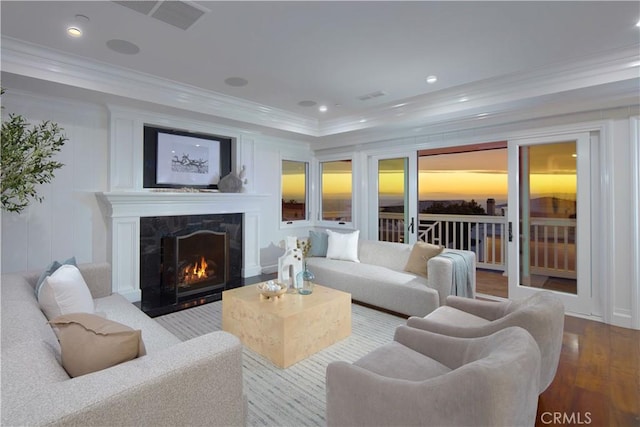 89 S La Senda Dr, Laguna Beach, CA 92651 - living area featuring visible vents, crown molding, a fireplace, wood finished floors, and recessed lighting