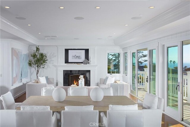 89 S La Senda Dr, Laguna Beach, CA 92651 - dining room featuring crown molding, a lit fireplace, recessed lighting, and wood finished floors
