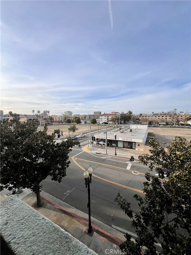 view of road featuring curbs and sidewalks