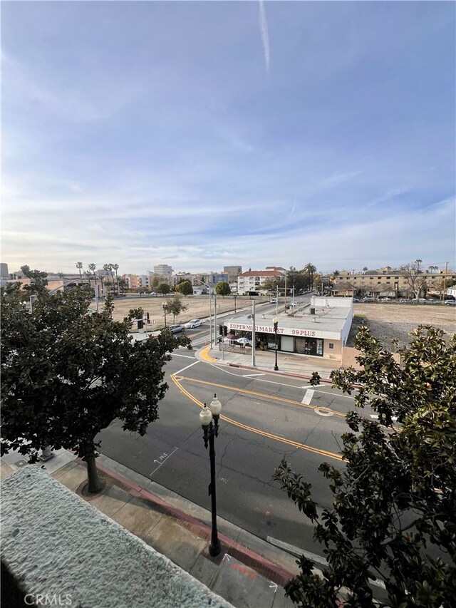 450 E 4th St Unit 304, Santa Ana, CA 92701 - view of asphalt road featuring sidewalks, curbs, and street lights