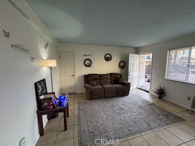 505 E Madison Ave Unit 84, El Cajon, CA 92020 - living room featuring light tile patterned floors and baseboards