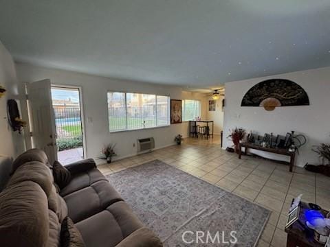 505 E Madison Ave Unit 84, El Cajon, CA 92020 - tiled living area featuring a wall mounted air conditioner and a ceiling fan