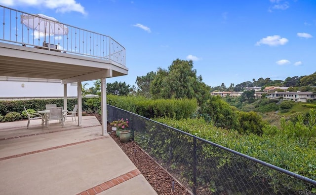 view of patio / terrace featuring fence and outdoor dining space
