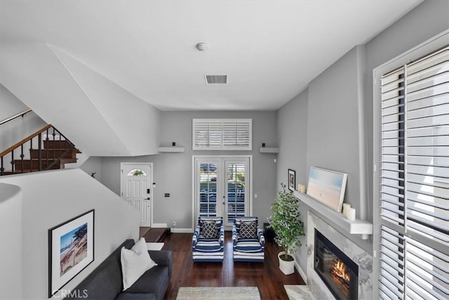 515 N Gertruda Ave Unit 9, Redondo Beach, CA 90277 - living room with wood finished floors, a fireplace, french doors, baseboards, and stairway