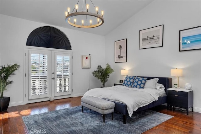 515 N Gertruda Ave Unit 9, Redondo Beach, CA 90277 - bedroom featuring access to exterior, lofted ceiling, a chandelier, wood-type flooring, and baseboards