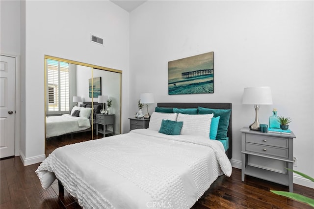 515 N Gertruda Ave Unit 9, Redondo Beach, CA 90277 - bedroom featuring a closet, wood finished floors, a towering ceiling, and baseboards