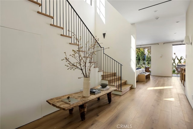 4209 Vantage Ave, Studio City, CA 91604 - foyer entrance featuring hardwood / wood-style flooring, stairs, and a towering ceiling