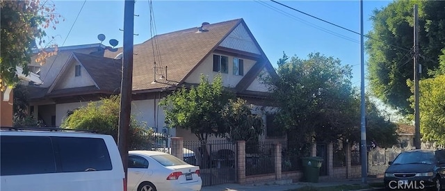 view of side of home with fence
