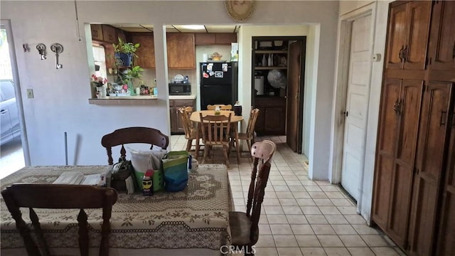 dining room with light tile patterned flooring