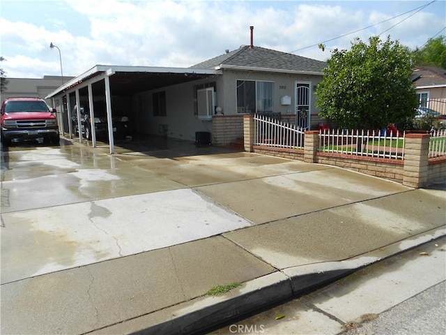 1312 Pleasant Vw, Corona, CA 92882 - view of front facade featuring stucco siding, fence, concrete driveway, a shingled roof, and an attached carport