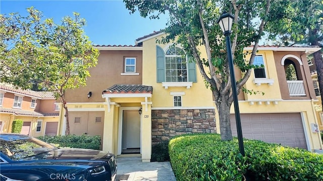 120 Timberwood, Irvine, CA 92620 - view of front facade with a garage, stucco siding, and a tiled roof