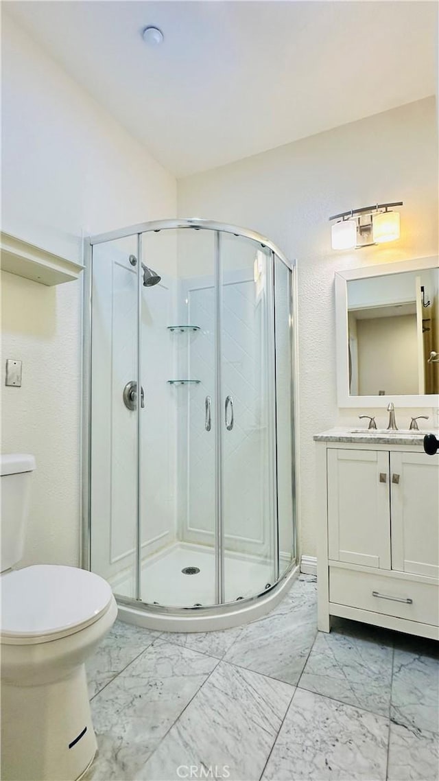 120 Timberwood, Irvine, CA 92620 - full bath with marble look tile flooring, toilet, a stall shower, and vanity