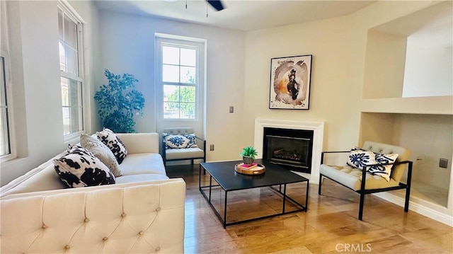 120 Timberwood, Irvine, CA 92620 - living area featuring a ceiling fan, wood finished floors, and a glass covered fireplace