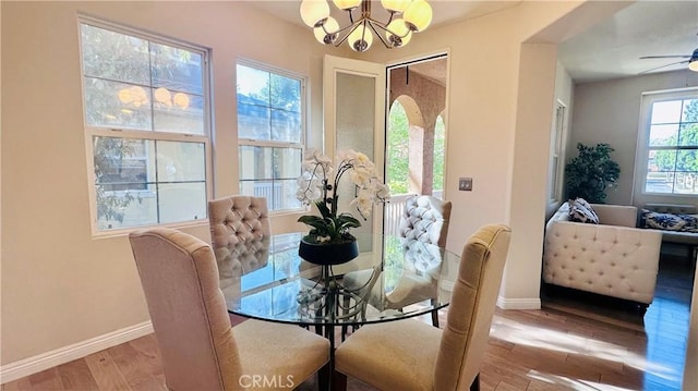 120 Timberwood, Irvine, CA 92620 - dining area with a chandelier, baseboards, wood finished floors, and ceiling fan