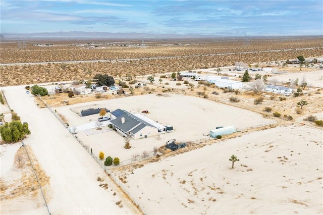 aerial view featuring a rural view, a mountain view, and a desert view