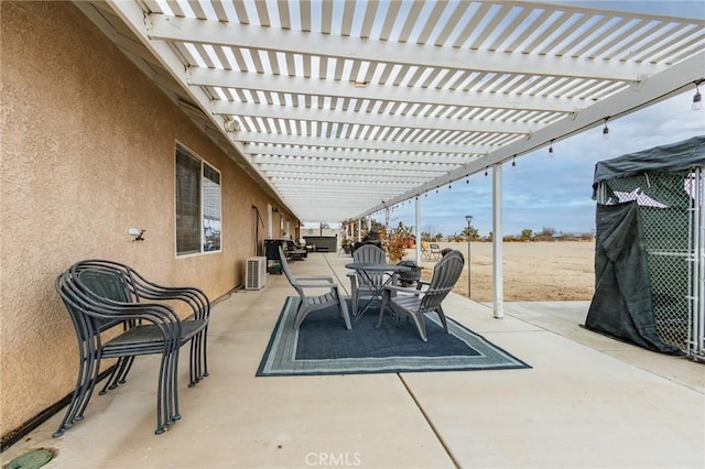view of patio featuring outdoor dining space, a pergola, and cooling unit