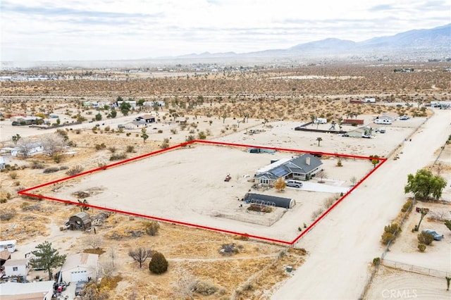aerial view featuring a rural view, a mountain view, and view of desert