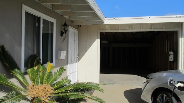 doorway to property with a garage